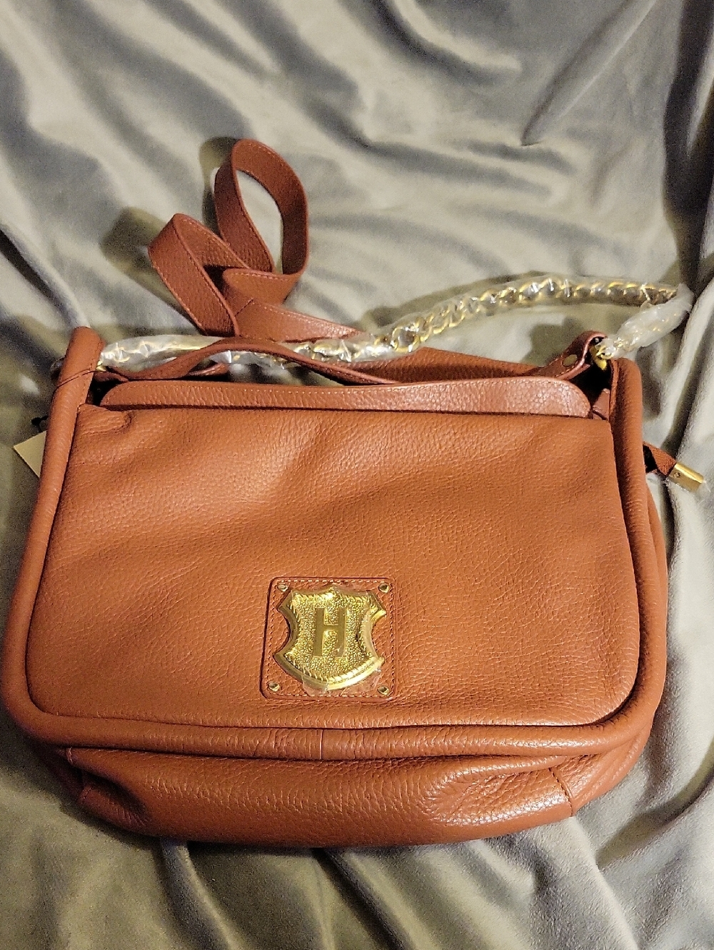 Women’s Cognac Leather Crossbody Bag with Gold Shield Accent